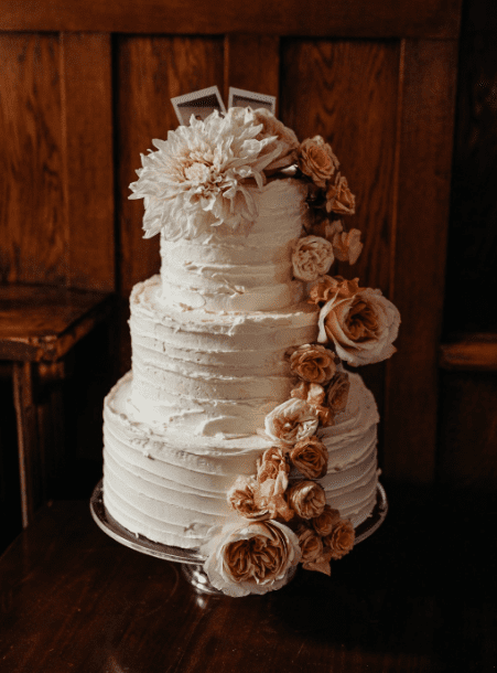 London_Wedding1 orange and pink flowers decorate a wedding cake