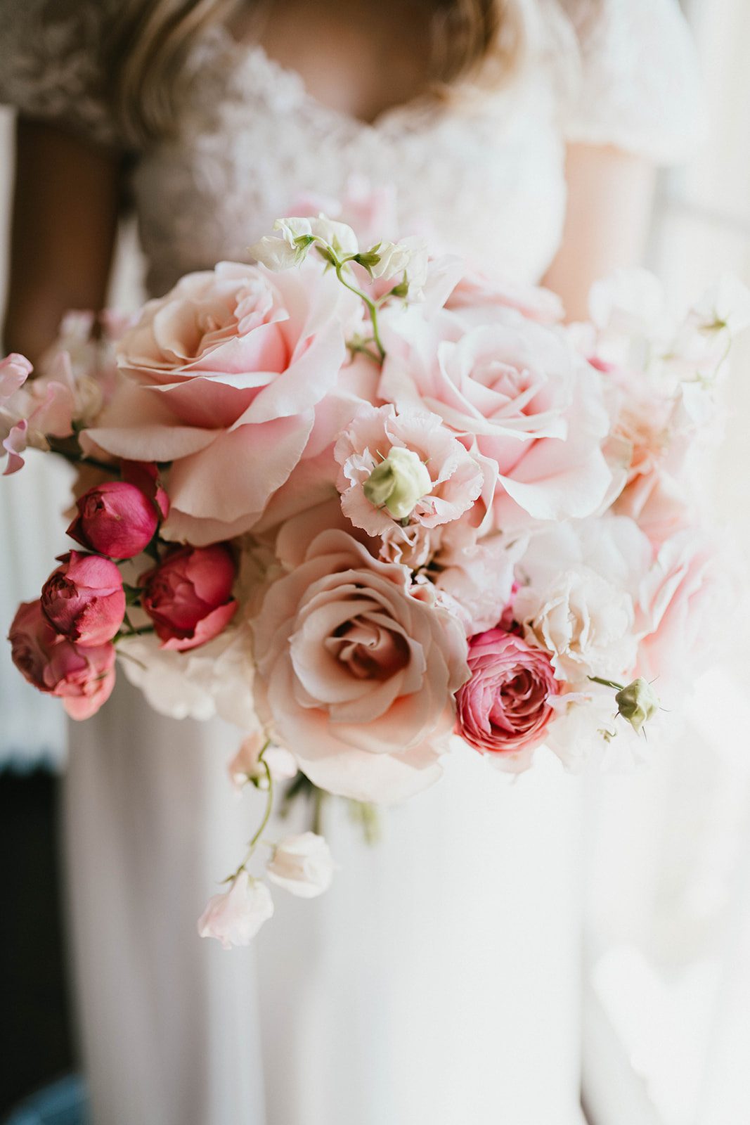 Lydia & Jason Bride holding out her bridal bouquet