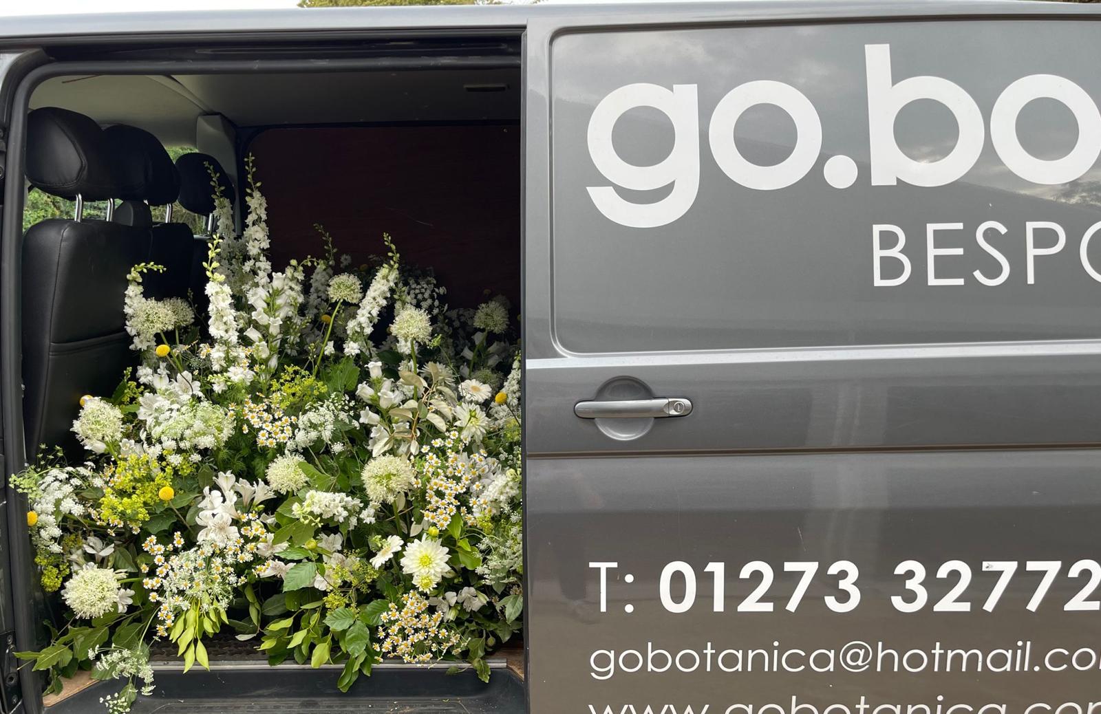 Grey florist van with large bouquets for events