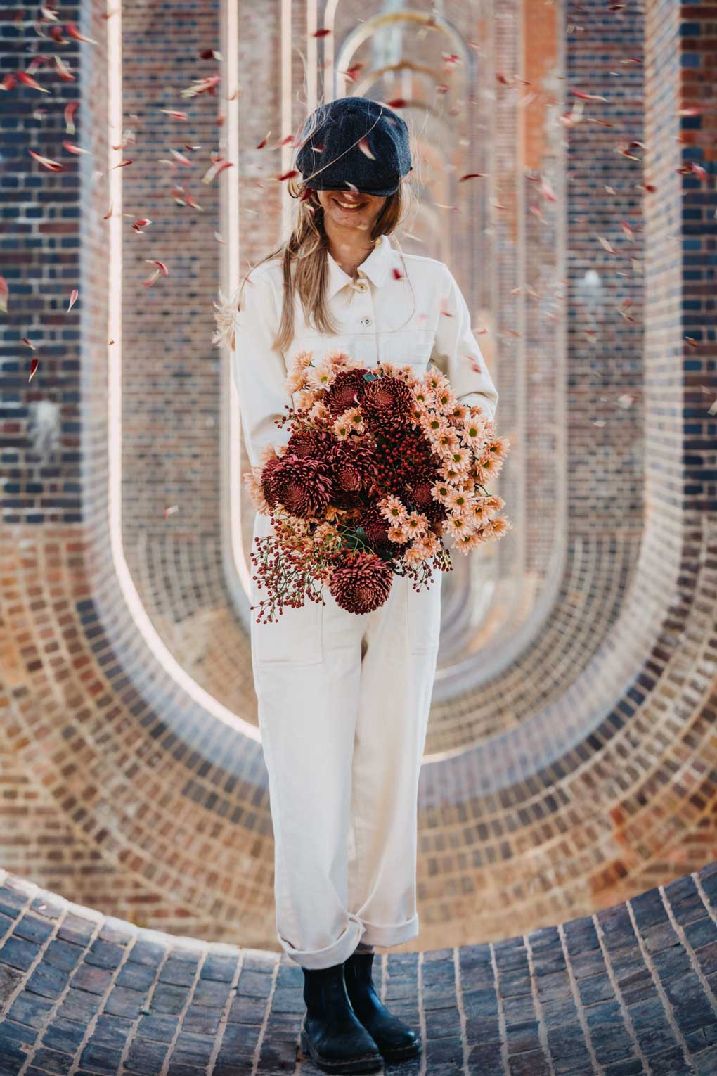 woman by a pool with floral outfit