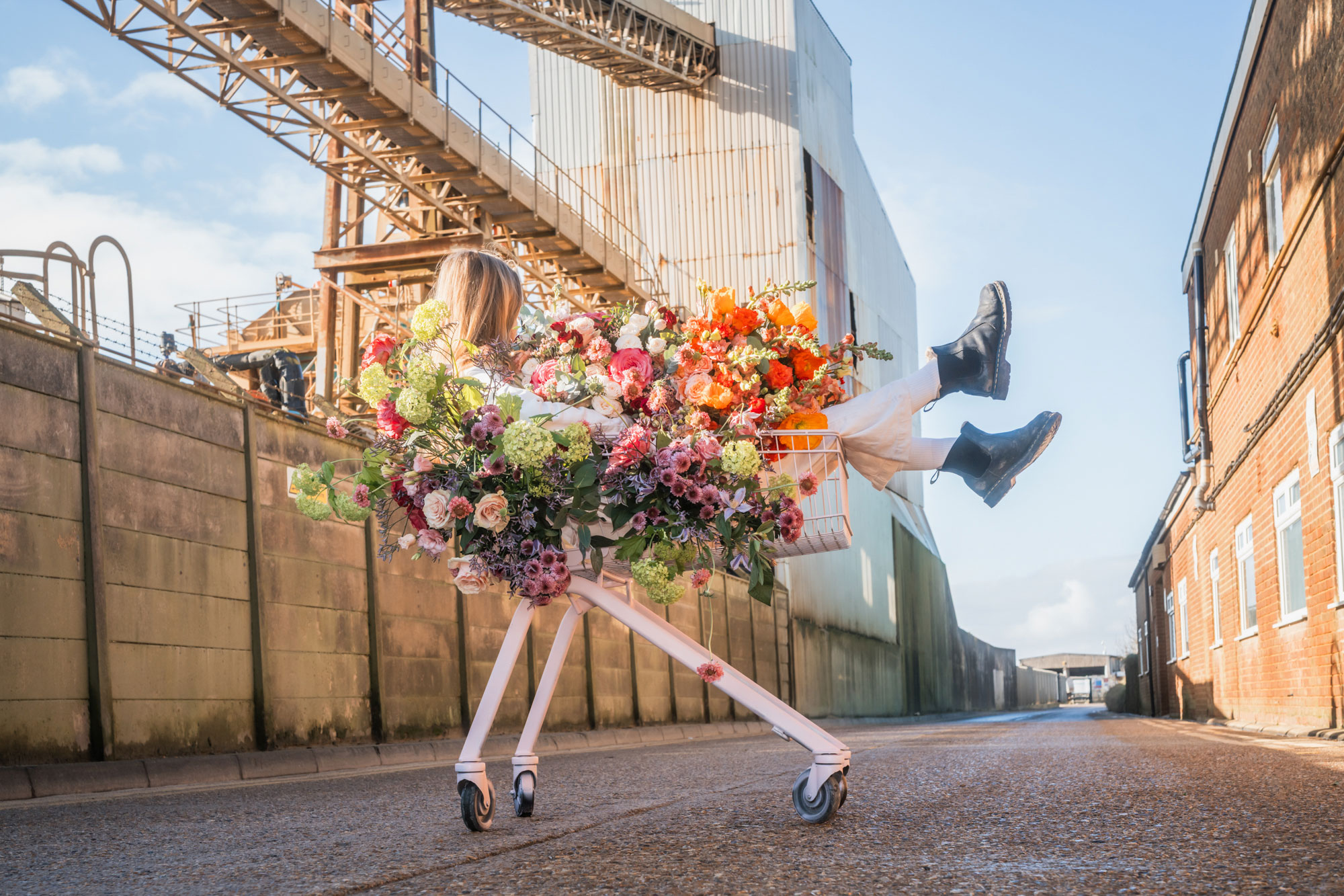 woman by a pool with floral outfit